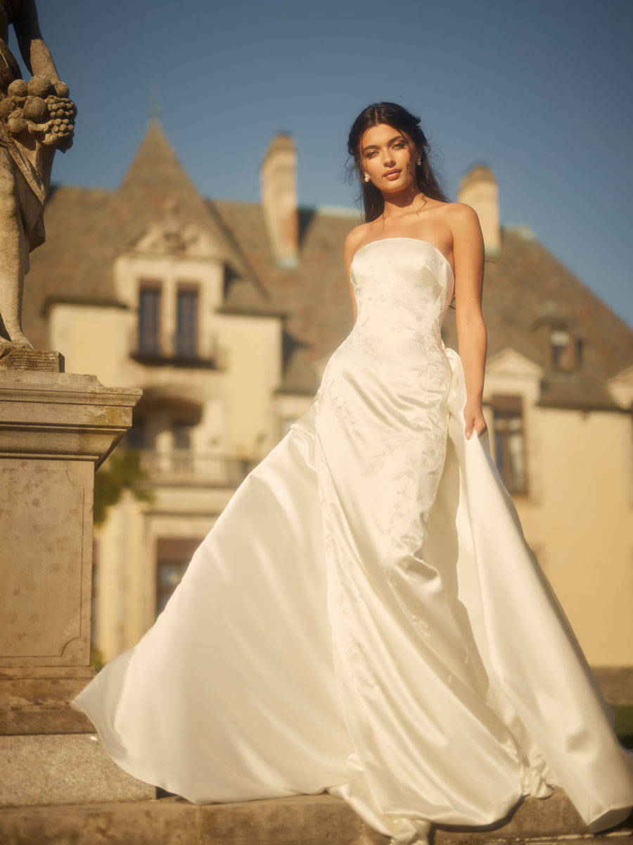 Love Couture Bridal Wedding Dresses Lady adorned in stunning Wedding Dresses.