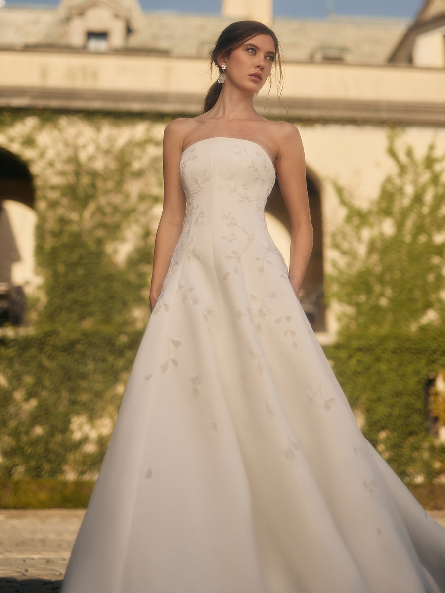 Love Couture Bridal Wedding Dresses Bride flaunting intricate Wedding Dresses.