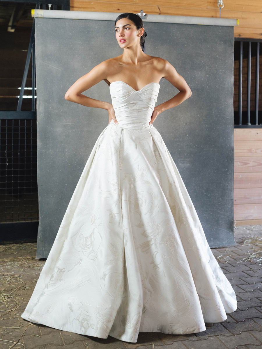 Lady in off-the-shoulder Love Couture Bridal Wedding Dresses.