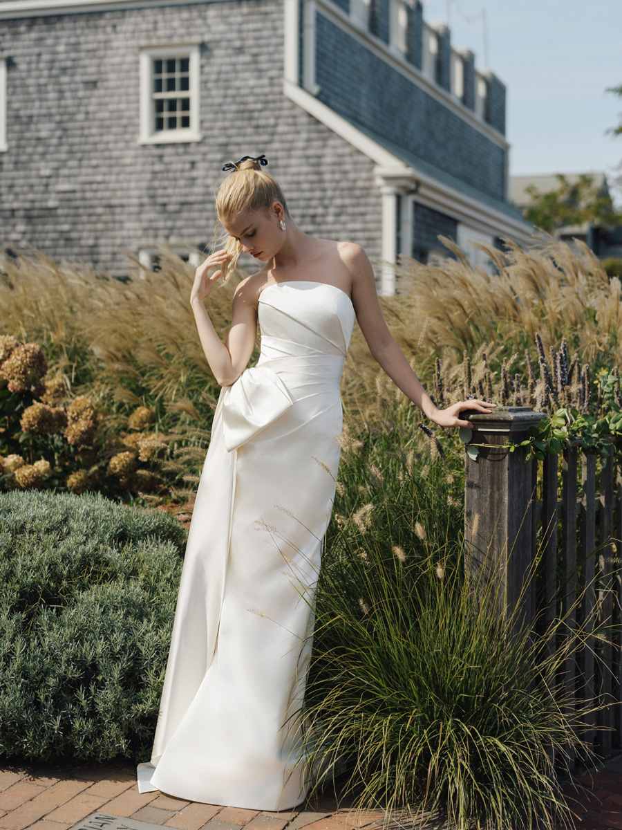 Woman in classic lace Love Couture Bridal Wedding Dresses.