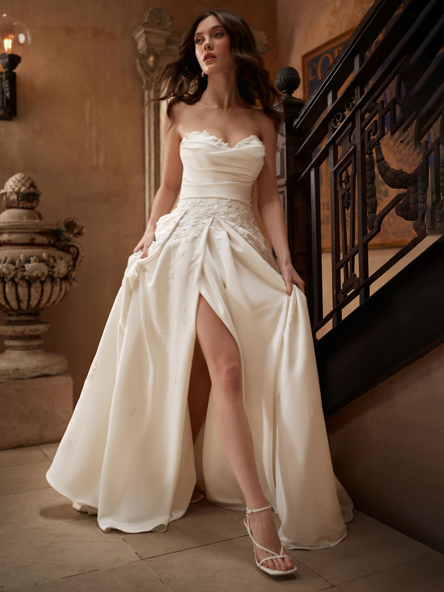 Love Couture Bridal Wedding Dresses Woman in whimsical Wedding Dresses.