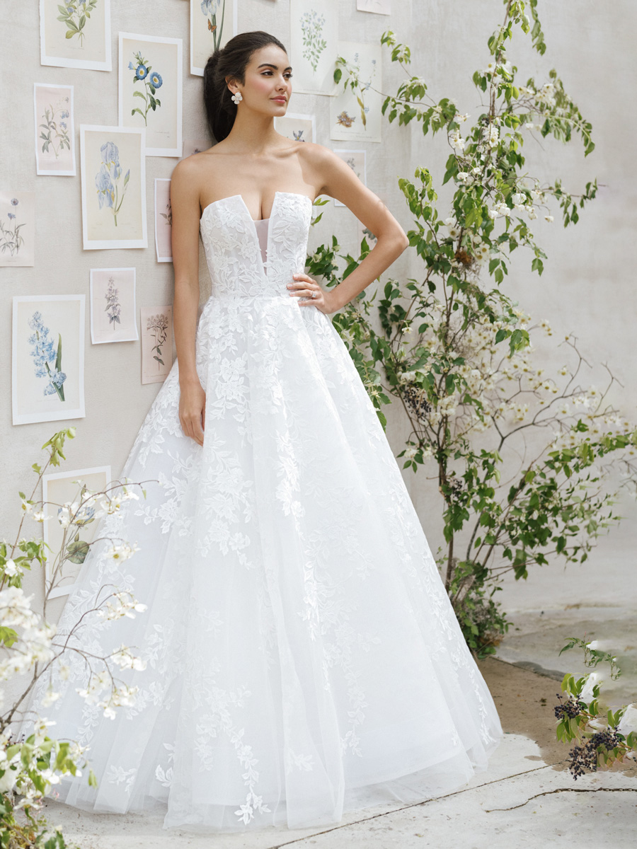 Lady in artistic Love Couture Bridal Wedding Dresses.