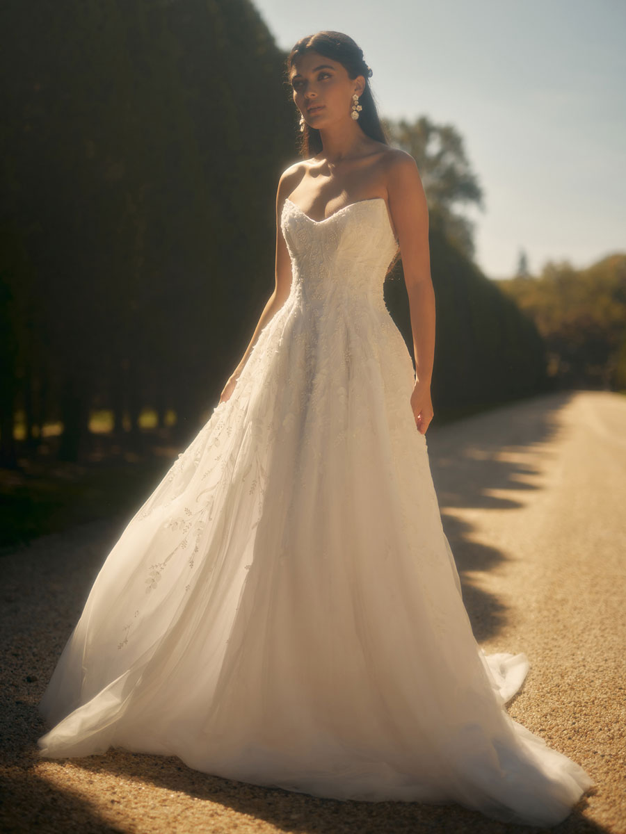 Love Couture Bridal Wedding Dresses Woman in opulent Wedding Dresses.