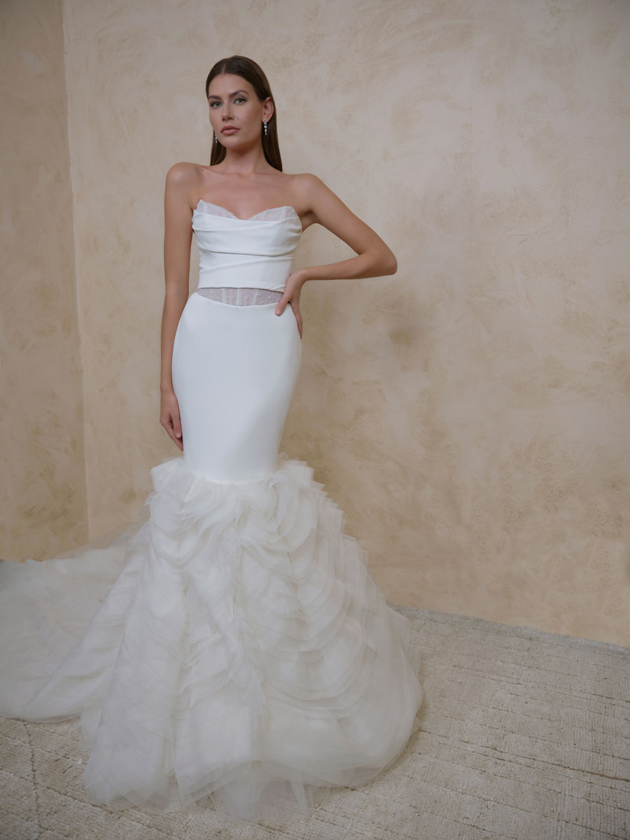 Love Couture Bridal Wedding Dresses Woman modeling beautiful Wedding Dresses.