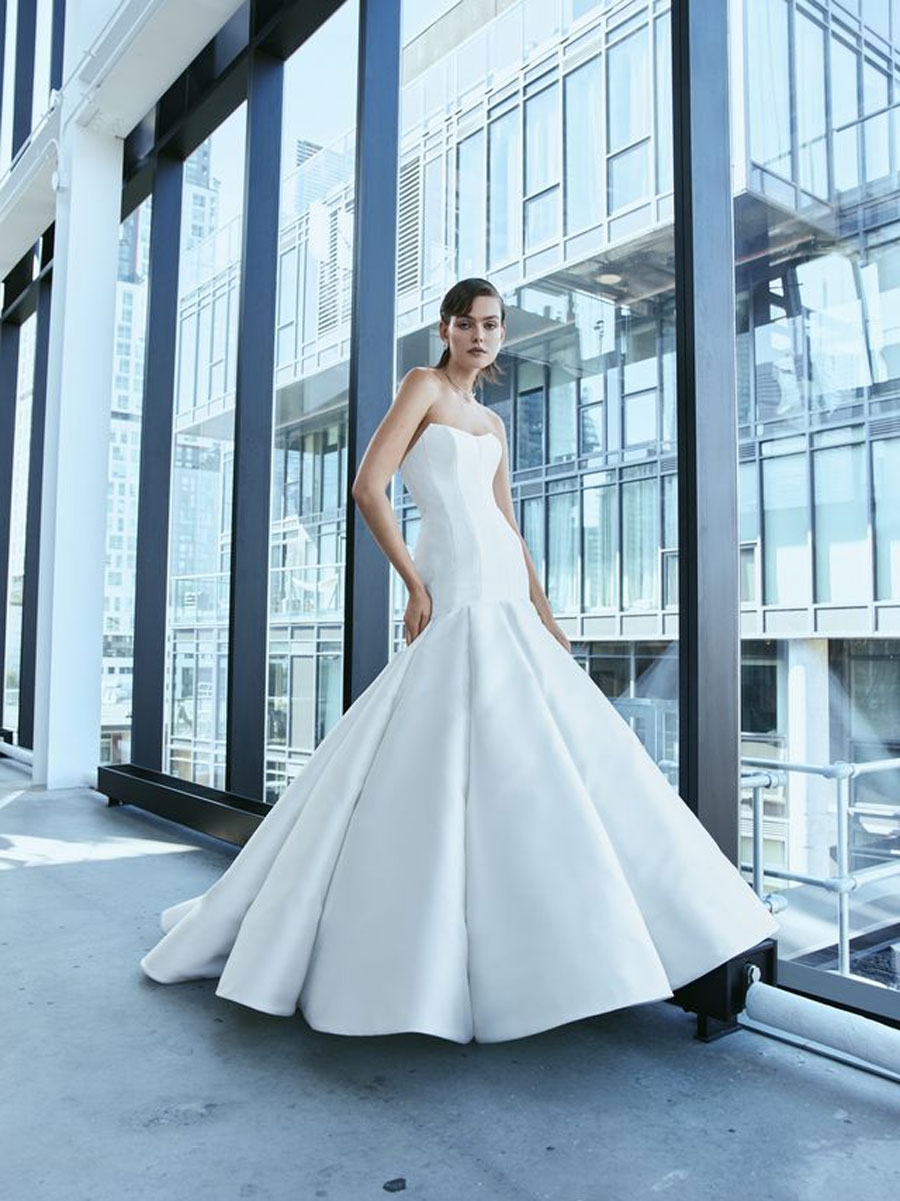 Love Couture Bridal Wedding Dresses Lady flaunting designer Wedding Dresses.