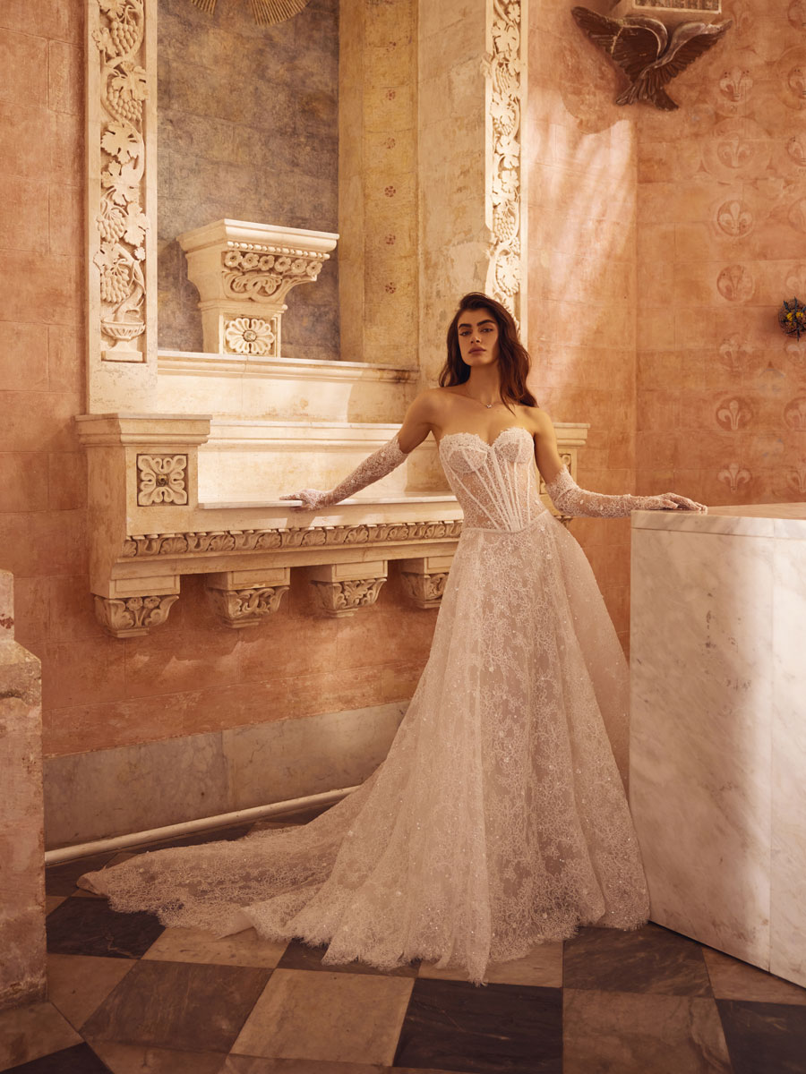 Love Couture Bridal Wedding Dresses. Bride in wedding dresses by ancient stone steps and ruins.