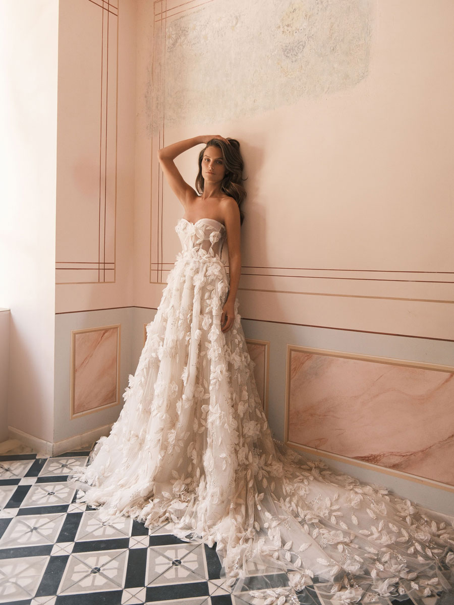 Love Couture Bridal Wedding Dresses Woman flaunting an artistic Wedding Dresses.