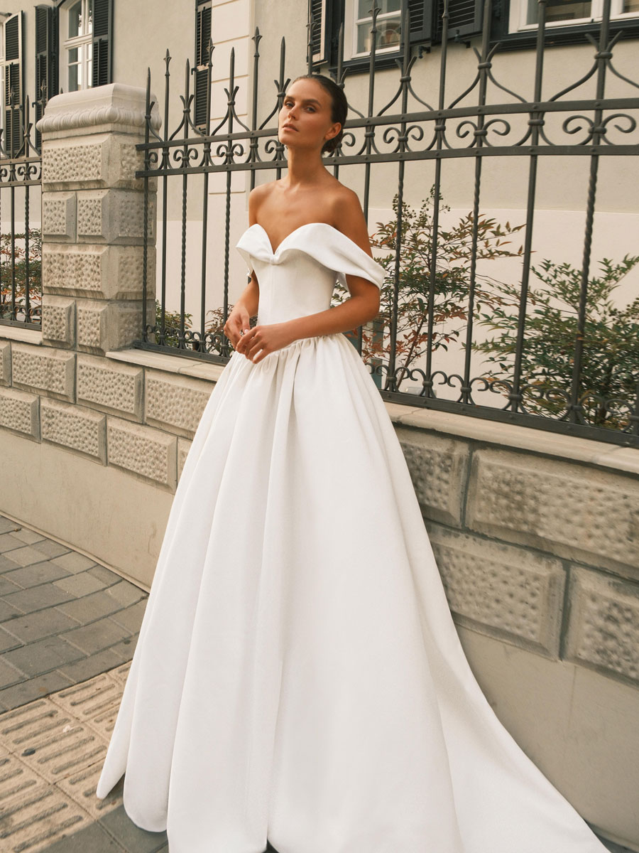 Bride in a stunning, fairy-tale Love Couture Bridal Wedding Dresses.