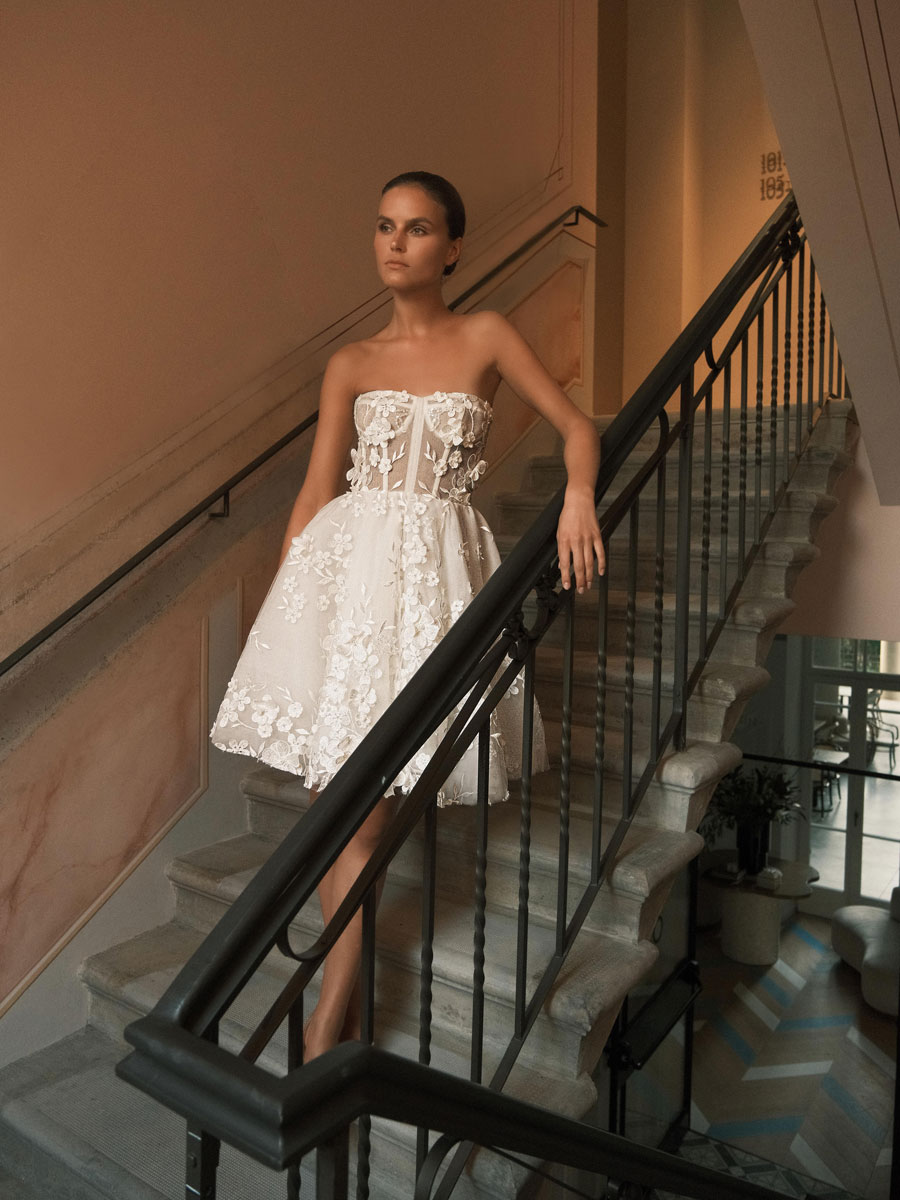 Lady flaunting an ornate, vintage Love Couture Bridal Wedding Dresses.