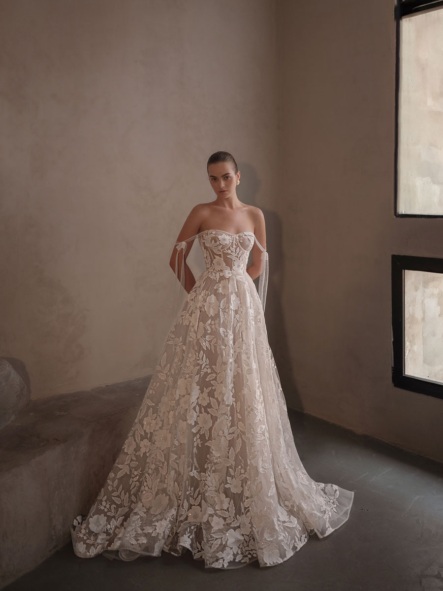 Woman modeling a unique, artistic Love Couture Bridal Wedding Dresses.