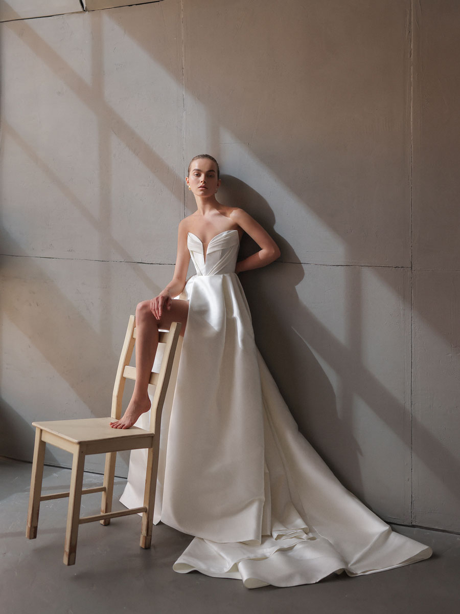 Woman flaunting a chic, minimalist Love Couture Bridal Wedding Dresses.