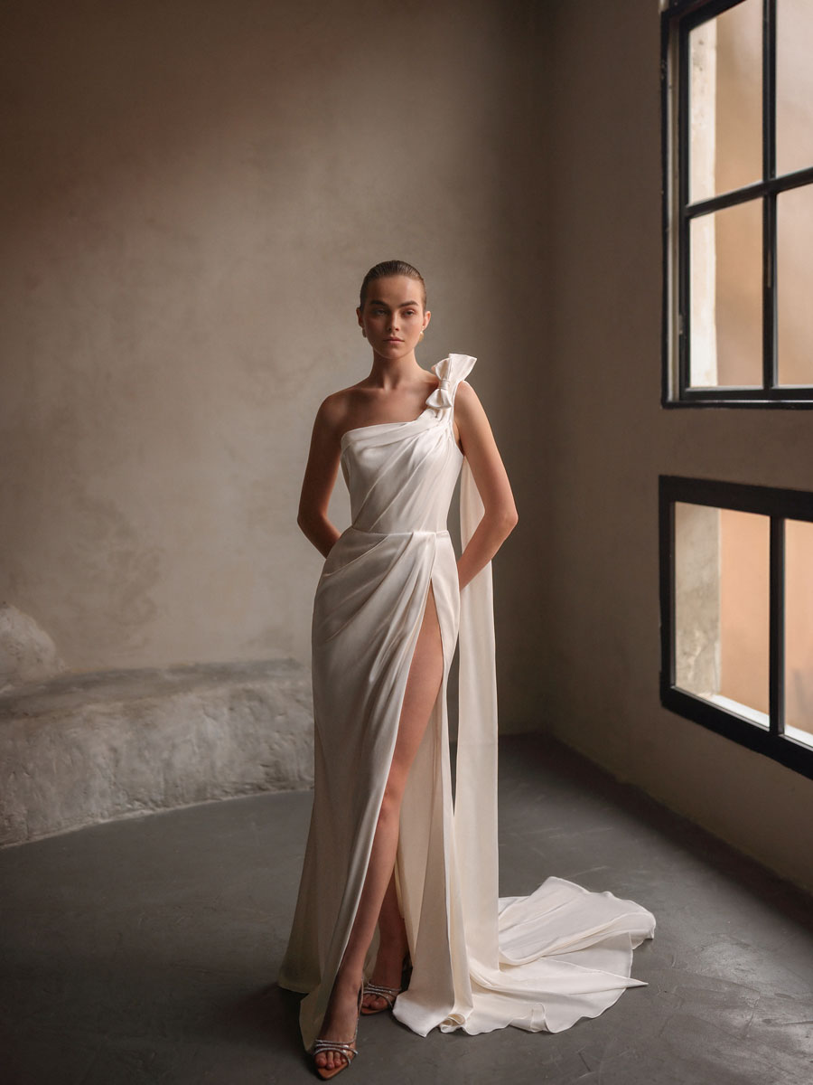 Lady in an elegant, ethereal Love Couture Bridal Wedding Dresses.