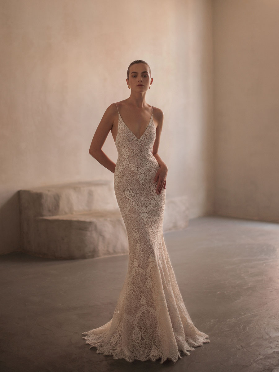 Lady flaunting a glamorous, off-the-shoulder Love Couture Bridal Wedding Dresses.